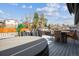Relaxing backyard deck with a hot tub, grill, and outdoor dining set; perfect for entertaining at 9379 W Burgundy Ave, Littleton, CO 80123