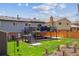 Picturesque backyard featuring a deck, lush lawn, and a fence, perfect for outdoor enjoyment at 9379 W Burgundy Ave, Littleton, CO 80123
