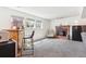 Relaxing basement with bar area, brick fireplace, and comfortable seating at 9379 W Burgundy Ave, Littleton, CO 80123