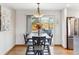 Cozy dining area featuring modern table set next to sliding glass door with backyard view at 9379 W Burgundy Ave, Littleton, CO 80123