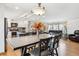 Spacious, open-concept layout seamlessly integrates kitchen, dining, and living areas with hardwood floors at 9379 W Burgundy Ave, Littleton, CO 80123