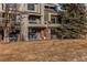 Private patio with grass, trees, and mountain views at 8855 Green Meadows Dr, Highlands Ranch, CO 80126