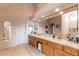 Bathroom with double vanity, large mirror, and ample storage at 8855 Green Meadows Dr, Highlands Ranch, CO 80126