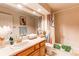Main bathroom with updated vanity, fixtures, and shower/tub at 8855 Green Meadows Dr, Highlands Ranch, CO 80126