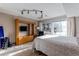 Comfortable bedroom with a built-in entertainment center at 8855 Green Meadows Dr, Highlands Ranch, CO 80126