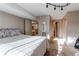 Spacious bedroom with a comfortable bed and access to the living area at 8855 Green Meadows Dr, Highlands Ranch, CO 80126