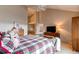 Primary bedroom with a large bed, dresser and TV at 8855 Green Meadows Dr, Highlands Ranch, CO 80126