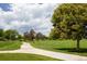 Paved pathway meanders through a grassy park-like setting at 8855 Green Meadows Dr, Highlands Ranch, CO 80126