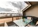 Private deck with glass-top table and mountain views at 8855 Green Meadows Dr, Highlands Ranch, CO 80126