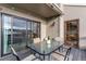 Deck with glass-top table, chairs, and sliding glass doors at 8855 Green Meadows Dr, Highlands Ranch, CO 80126