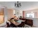 Bright dining area with wood table and sideboard at 8855 Green Meadows Dr, Highlands Ranch, CO 80126