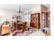 Mid-century modern dining room with wood table and chairs at 8855 Green Meadows Dr, Highlands Ranch, CO 80126