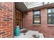 Brick front entryway with teal planter and small steps at 8855 Green Meadows Dr, Highlands Ranch, CO 80126