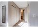 Hallway with double closets and bathroom access at 8855 Green Meadows Dr, Highlands Ranch, CO 80126