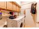 Bright laundry room with washer, dryer, and ample storage at 8855 Green Meadows Dr, Highlands Ranch, CO 80126