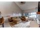 Spacious living room featuring a comfortable sectional sofa and large windows at 8855 Green Meadows Dr, Highlands Ranch, CO 80126