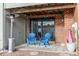 Cozy covered patio with brick wall and heater at 8855 Green Meadows Dr, Highlands Ranch, CO 80126