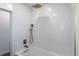 Bright bathroom with white herringbone tile and gold fixtures at 2031 W 37Th Ave, Denver, CO 80211