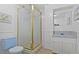 Cozy bathroom featuring a tiled shower and bright blue toilet at 1331 Alpine St, Longmont, CO 80504