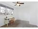 Bedroom featuring carpet, ceiling fan, large window, desk and chair at 1331 Alpine St, Longmont, CO 80504