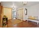 Bright foyer featuring hardwood floors, stylish lighting, and a welcoming bench at 1331 Alpine St, Longmont, CO 80504