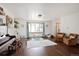 Spacious living room with hardwood floors, a large window, and comfortable seating at 1331 Alpine St, Longmont, CO 80504