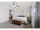 Bright bedroom with neutral carpet, white walls, ceiling fan, and backyard view at 1331 Alpine St, Longmont, CO 80504