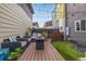 Relaxing backyard deck featuring comfortable seating and decorative string lights, ideal for gatherings at 2824 W Parkside Pl, Denver, CO 80221
