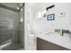 Bathroom featuring stand-up shower, toilet, modern sink, and neutral color scheme for simple elegance at 2824 W Parkside Pl, Denver, CO 80221