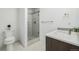 Bathroom featuring stand-up shower, toilet, modern sink, and neutral color scheme for simple elegance at 2824 W Parkside Pl, Denver, CO 80221