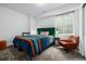 Bedroom features natural light, soft carpet, and eclectic decor for cozy living at 2824 W Parkside Pl, Denver, CO 80221