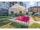 Exterior view of a greenhouse with bike racks and seating nearby providing a serene spot in the neighborhood at 2824 W Parkside Pl, Denver, CO 80221