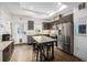 Bright modern kitchen features stainless appliances, a marble island, modern cabinetry, and a skylight at 2824 W Parkside Pl, Denver, CO 80221