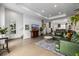 Inviting living room featuring hardwood floors, natural light, and open layout at 2824 W Parkside Pl, Denver, CO 80221