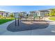A community playground featuring exercise zone and modern equipment with well-maintained landscaping at 2824 W Parkside Pl, Denver, CO 80221
