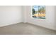 Inviting bedroom with soft carpet flooring and a large window framing neighborhood views at 4650 W 9Th Ave, Denver, CO 80204