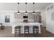 Contemporary kitchen featuring gray cabinetry, stainless steel appliances, and a quartz countertop island at 4650 W 9Th Ave, Denver, CO 80204