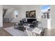 Modern living room featuring a comfortable sofa, stylish coffee table, and staircase at 4650 W 9Th Ave, Denver, CO 80204