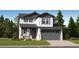 Charming two-story home with gray garage door and a beautifully landscaped front yard at 7759 S Cherokee Trl, Centennial, CO 80016