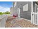 Private backyard showcasing stone walkway, low-maintenance landscaping, and quaint outdoor seating area at 18645 E 54Th Pl, Denver, CO 80249