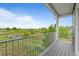 Spacious balcony offers stunning views of green landscape, perfect for relaxation and outdoor enjoyment at 18645 E 54Th Pl, Denver, CO 80249
