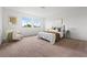 Bright bedroom with large windows and neutral decor at 18645 E 54Th Pl, Denver, CO 80249