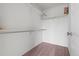 Walk-in closet features ample shelving, carpeting, and a minimalist design for organized storage at 18645 E 54Th Pl, Denver, CO 80249