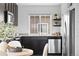 Contemporary kitchen featuring stainless steel appliances, dark cabinets, and open shelving at 18645 E 54Th Pl, Denver, CO 80249
