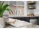Kitchen showcasing granite countertops, stainless steel appliances, a modern sink, and decoratively styled shelves at 18645 E 54Th Pl, Denver, CO 80249