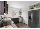 Updated kitchen equipped with stainless steel appliances, granite countertops, and ample cabinet space at 18645 E 54Th Pl, Denver, CO 80249