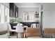 Eat-in kitchen features black cabinets, stainless steel appliances, and modern decor at 18645 E 54Th Pl, Denver, CO 80249