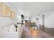 Open-concept living area showcases stylish furniture, modern design, and seamless flow to the kitchen at 18645 E 54Th Pl, Denver, CO 80249