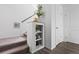 Staircase with carpeted steps, modern railing, and decorative shelving for an elegant touch at 18645 E 54Th Pl, Denver, CO 80249