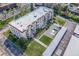 Aerial view of an apartment complex with balconies, a pool, and carports at 7801 W 35Th Ave # 406, Wheat Ridge, CO 80033